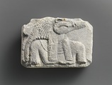 Relief plaque, upper part of crocodile-headed god, Limestone