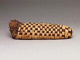 Sacred animal mummy of a canid, Dyed and undyed linen, animal remains, mummification materials
