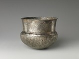 Bowl with flutes from shoulder to rosette at base and with inscribed weight, Silver