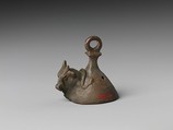 Bell with head of a bovine wearing a yoke ending in uraei, Leaded bronze