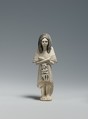 Shabti of the Scribe Huy wearing a Bat-pendant, Limestone, pigment