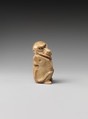 Game piece in the shape of a baboon, Bone