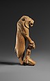 Statuette of lion holding a Nubian captive, Wood