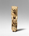 Statuette of lion holding a Nubian captive, Wood