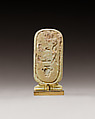 Cartouche-shaped plaque with the names of Apries, Faience