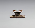 Headrest amulet, Stone