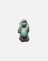 Part of a figurine of a female figure supporting a male on her back, Faience