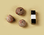 Three large spherical beads, Clay (unfired), pigment
