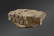 Possible trial piece depicting a lion-headed deity, Stone