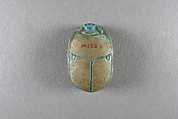 Scarab inscribed with the name Taharqo, Faience
