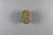 Scarab inscribed with the name Shepenwepet, Steatite, traces of green glaze
