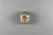 Scarab inscribed with the name Shepenwepet, Steatite, traces of green glaze