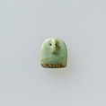 Shield shaped attachment or amulet with four holes connected by diagonals, Feldspar