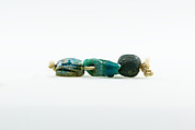Falcon amulet, Green faience