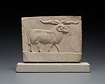 Relief plaque with bull, opposite side ram, Limestone