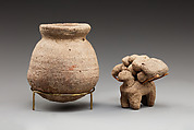 Donkey with packs on its back, Clay, twigs