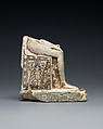 Lower half of a goddess on a throne with Bes figures, its base formed by prostrate captives, Faience