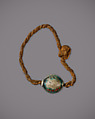 String Bracelet with a Cowroid Amulet, Glazed steatite, linen cord