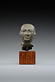 Head from the figure of an official, Fine-grained greenish-grey stone