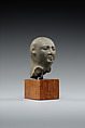 Head from the figure of an official, Fine-grained greenish-grey stone