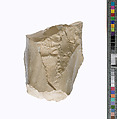 Knee with pleated garment, Indurated limestone