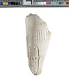 Left forearm with garment fringe, pleating and Aten cartouche, Indurated limestone