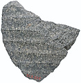 Body fragment with garment pleats, diorite