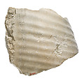 Garment fragment with gathers, probably male, Indurated limestone