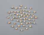Tray of clay balls with embedded faience ring beads, Low-fired whitish clay, faience