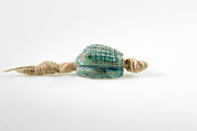 Seal in the shape of a hedgehog on original string, Green glazed steatite