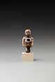 Statuette of a cult attendant with a jar, Bronze or cupreous alloy