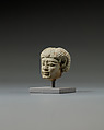 Head from a statuette, perhaps of  a dwarf, Faience