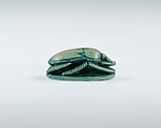 Scarab Depicting Ramesses II Smiting a Prisoner Before Amun, Steatite, glazed
