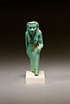 Statuette of a worn or aged woman, probably a goddess, Faience