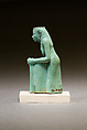Statuette of a worn or aged woman, probably a goddess, Faience