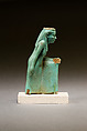 Statuette of a worn or aged woman, probably a goddess, Faience