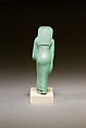 Statuette of a worn or aged woman, probably a goddess, Faience
