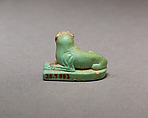 Reclining dog, Pale green faience