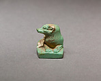 Reclining dog, Pale green faience