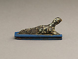 Falcon-headed crocodile, possibly Soknopaios, Stone or porphyry (?); base of glass