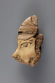 Tile with a fragment from a head of a Mesopotamian captive from the palace of Ramesses II, Faience
