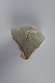 Tile fragment, part of a wig from a figure of the king, Faience