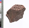 Crown with discs and two adjoining surfaces, Red quartzite