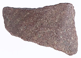limb fragment with faint garment pleats, Red quartzite