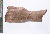 left hand and arm fragment with Aten cartouches from a statue supporting a stela?, Red quartzite