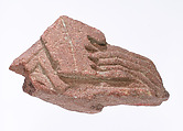 Hand casting incense (?) over an offering pile, Red quartzite