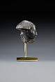 Head fragment from a statuette depicting a "Bald one of Hathor" priest, Steatite