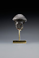 Head fragment from a statuette depicting a "Bald one of Hathor" priest, Steatite
