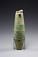 Biconical alabastron with zones of bichrome decoration including floral elements, dancers, and Bes-like figures, Faience