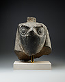 Falcon head with divine wig from a statue with an anthropomorphic body, Diorite